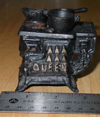 MINIATURE CAST IRON QUEEN COOK STOVE  